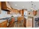 Spacious kitchen with stainless steel appliances, a tile backsplash, and a breakfast bar at 156 S Lookout Mountain Rd, Golden, CO 80401