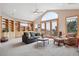 Bright living room with built-in bookshelves, large windows, and comfortable seating arrangement at 156 S Lookout Mountain Rd, Golden, CO 80401