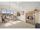 Inviting living room featuring a stone fireplace, large windows, and comfortable seating at 156 S Lookout Mountain Rd, Golden, CO 80401