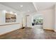 Open-concept living room featuring tile floors, archways, and natural light at 156 S Lookout Mountain Rd, Golden, CO 80401