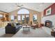 Inviting living room featuring a fireplace, comfortable seating, and large windows offering scenic views at 156 S Lookout Mountain Rd, Golden, CO 80401