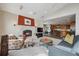 Open-concept living room features a fireplace, and seamless access to the kitchen and dining area at 156 S Lookout Mountain Rd, Golden, CO 80401