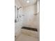 Contemporary shower featuring a built-in bench, rainfall showerhead, and tiled surround at 156 S Lookout Mountain Rd, Golden, CO 80401