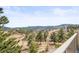 Scenic view of a wooded landscape with rolling hills and trees, providing a sense of tranquility and natural beauty at 156 S Lookout Mountain Rd, Golden, CO 80401