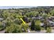 Aerial view of a property showcasing its location and surrounded by lush greenery and mature trees at 1560 Findlay Way, Boulder, CO 80305
