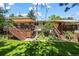 Beautiful backyard featuring a lush lawn, mature trees, and a spacious deck perfect for entertaining at 1560 Findlay Way, Boulder, CO 80305