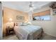 Comfortable bedroom with a ceiling fan, large window, and neutral tones to create a peaceful retreat at 1560 Findlay Way, Boulder, CO 80305