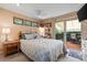 Relaxing bedroom with access to an outdoor deck through a sliding glass door for serene outdoor views at 1560 Findlay Way, Boulder, CO 80305