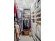 Walk-in closet with custom shelving, hanging rods, and plenty of room for storage and organization at 1560 Findlay Way, Boulder, CO 80305