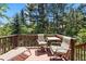 Spacious deck with seating offers scenic views of towering trees and a tranquil outdoor setting at 1560 Findlay Way, Boulder, CO 80305