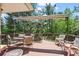 Spacious outdoor deck with shade covering, perfect for al fresco dining and entertaining guests in style at 1560 Findlay Way, Boulder, CO 80305