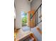 Inviting entryway features a decorative front door and staircase leading to the upper level at 1560 Findlay Way, Boulder, CO 80305