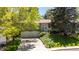 Charming home with a well-manicured lawn, mature trees, and a two-car garage, perfect for suburban living at 1560 Findlay Way, Boulder, CO 80305