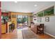 Bright kitchen with bar seating, wooden cabinets, and sliding door access to the deck at 1560 Findlay Way, Boulder, CO 80305