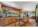 Well-lit kitchen with granite countertops, wooden cabinets, and a spacious island with bar seating at 1560 Findlay Way, Boulder, CO 80305
