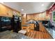 Well-equipped kitchen featuring wooden cabinets, stainless steel appliances and a functional center island at 1560 Findlay Way, Boulder, CO 80305