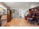 Inviting living room featuring hardwood floors, a staircase, and a cozy study nook with built-in shelving at 1560 Findlay Way, Boulder, CO 80305