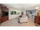 Comfortable living room showcasing a built-in entertainment unit and bright window, ideal for Gathering time at 1560 Findlay Way, Boulder, CO 80305