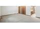 Large bedroom featuring plush carpeting and ample closet space for storage at 9431 W Jewell Pl, Lakewood, CO 80227