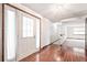 Welcoming entryway with hardwood floors, a white front door, and access to other living spaces at 9431 W Jewell Pl, Lakewood, CO 80227