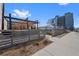 Street view with modern building and outdoor pergola at 3225 Blake St # 8, Denver, CO 80205