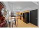 Bright kitchen featuring stainless steel appliances, wood floors, and bar seating at 3225 Blake St # 8, Denver, CO 80205
