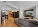 Open-concept living area showcasing a sleek kitchen, modern entertainment center, and comfortable seating at 3225 Blake St # 8, Denver, CO 80205