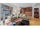 Open-concept living room featuring hardwood floors, modern décor, and ample natural light at 3225 Blake St # 8, Denver, CO 80205