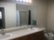 Bathroom with double sinks, a large mirror, and a toilet at 2977 W 119Th Ave # 202, Westminster, CO 80234