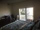 Bright bedroom with a queen bed, private balcony, and workspace at 2977 W 119Th Ave # 202, Westminster, CO 80234