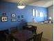 Bright dining area with a square table and blue walls at 2977 W 119Th Ave # 202, Westminster, CO 80234