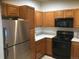 Kitchen features stainless steel appliances and ample wood cabinetry at 2977 W 119Th Ave # 202, Westminster, CO 80234