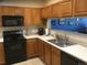 Functional kitchen featuring modern appliances, cabinets, and light countertops at 2977 W 119Th Ave # 202, Westminster, CO 80234