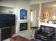 Living room with a fireplace and built-in shelving at 2977 W 119Th Ave # 202, Westminster, CO 80234