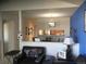 Inviting living room with comfortable seating and a view of the eat-in kitchen at 2977 W 119Th Ave # 202, Westminster, CO 80234