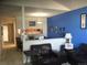 Spacious living room with a leather couch and a view into the dining area at 2977 W 119Th Ave # 202, Westminster, CO 80234