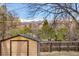 Backyard featuring a wooden storage shed and mountain views at 4631 Ashfield Dr, Boulder, CO 80301