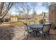 Backyard featuring a stone patio with a table, chairs, and a storage shed at 4631 Ashfield Dr, Boulder, CO 80301