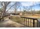 Backyard view from a wooden deck featuring a storage shed and a lawn at 4631 Ashfield Dr, Boulder, CO 80301