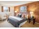 Comfortable bedroom featuring patterned wallpaper, ample natural light, and neutral furniture at 4631 Ashfield Dr, Boulder, CO 80301