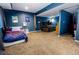 A well-lit bedroom features two beds, carpet, and a playful design at 57 N 45Th Ave, Brighton, CO 80601