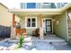 Inviting front porch with rocking chairs and stone accents, perfect for relaxation at 57 N 45Th Ave, Brighton, CO 80601