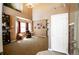 Bright living room with tall ceilings, a bay window, and neutral decor at 57 N 45Th Ave, Brighton, CO 80601