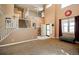 Spacious living room featuring high ceilings, a staircase, and ample natural light at 57 N 45Th Ave, Brighton, CO 80601