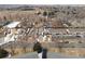 Birds eye view of residential area with homes, streets, and surrounding landscape, partially snow covered at 3695 Quail St, Wheat Ridge, CO 80033