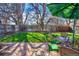 Backyard with patio, lush green grass, and outdoor seating at 3695 Quail St, Wheat Ridge, CO 80033