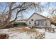 Backyard with patio, outdoor seating, and some snow covering the grass at 3695 Quail St, Wheat Ridge, CO 80033