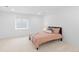 Bright bedroom featuring neutral decor, carpet, and a window that offers plenty of natural light at 3695 Quail St, Wheat Ridge, CO 80033