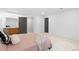 Carpeted bedroom featuring a stylish vanity, mirror and neutral decor at 3695 Quail St, Wheat Ridge, CO 80033