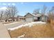 Inviting single-Gathering home featuring a two-car garage and well-maintained front yard with mature trees at 3695 Quail St, Wheat Ridge, CO 80033